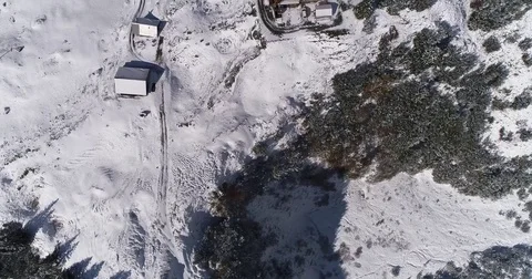 Aerial winter view of alps mountains and cabin hut in Austria. Drone tilting up  Stock Footage 80954085