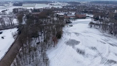 Aerial winter view of a large red brick castle with towers and a moat Vídeo Stock 331281823