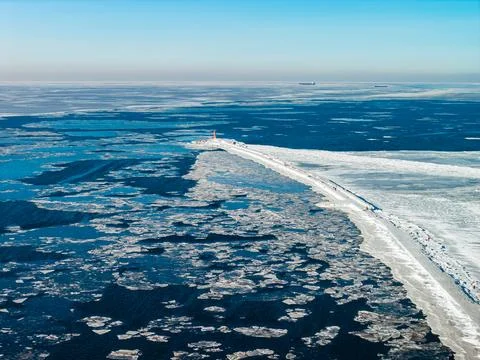 Aerial winter view of Mangalsala lighthouse and breakwater in Riga Stock Photos