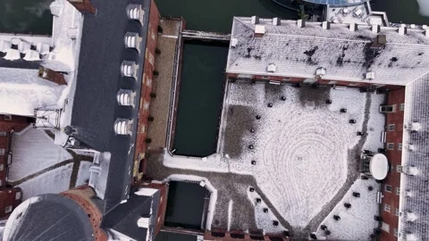 Aerial winter view of a red brick architectural complex with dark roofs Stock Footage 329187382