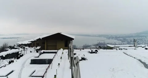 Aerial winter view of Srinagar with Dal Lake completely frozen beneath. Stock Footage 310656511
