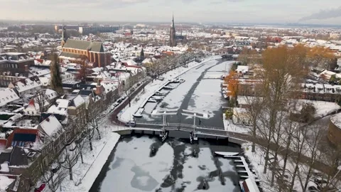 Aerial winter view of Weesp and river Vecht covered in snow, Netherlands Stock Footage 325974765