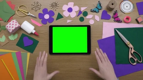 Aerial Of Woman Using Tablet Computer Surrounded By Craft Equipment Stock Footage 79678240