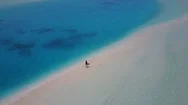 Aerial: Woman Walking Along Incredible Sandbank. Maldives Stock Footage