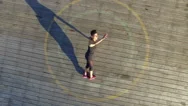 Aerial Of Woman Warming Up On A Sunny Day Stock Footage