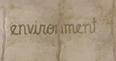 Aerial of the word environment in the sand Stock Footage 65511246