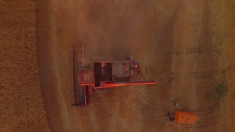 Aerial - Worker Removing Dust From Combine in Wheat Field Video stock 79800920