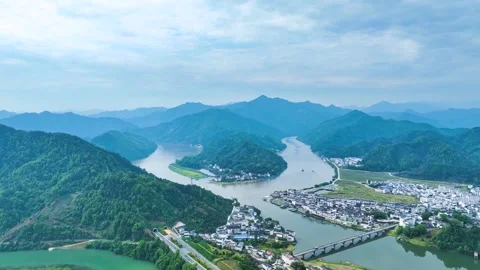 Aerial Xin'an River Winding Through Mountains and Chinese Village Architecture Stock Footage 342095813