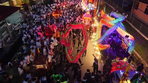 Aerial Yew Keng Religious Procession with Colorful Dragon Figures in Bukit Bakri Stock-Footage 345437457