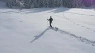 Aerial - Young Man Winter Hiking In A Company Of A Dog Stock Footage