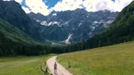 Aerial - Young Woman On Hike Toward The Mountains In Spring Stock Footage