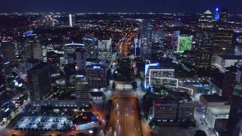 Aerial Zoom In and Down Towards Klyde Warren Park at Night Dallas Texas Stock Footage
