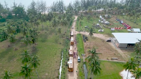 Aerial Zoom Out of Corporate Gathering Event with Buses at Watu Beach Balikp Vídeos de archivo 328395853