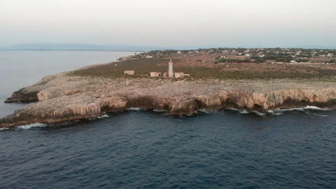 Aerial zoom in view of the Capo Murro di Porco lighthouse in Plemmirio Syracu Stock Footage 139775083