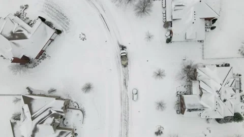 Aerial/Drone Top Down View of a Snow Plow in a Residential Neighborhood Stock Footage 236573254
