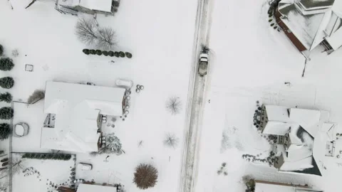 Aerial/Drone Top Down View of a Snow Plow in a Residential Neighborhood Stock Footage 236573257