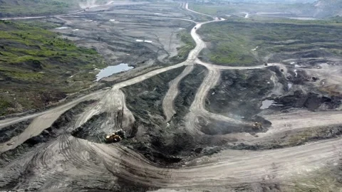 Aerial/Drone view of open mine pit coal mining activity. Water Pollution Stock Footage 165326011
