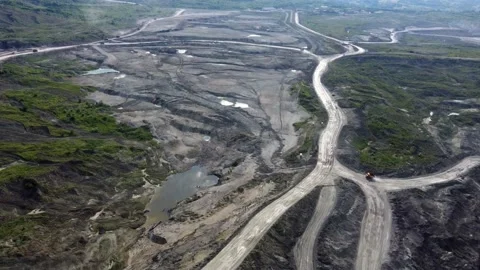 Aerial/Drone view of open mine pit coal mining activity. Water Pollution Stock Footage 165326326