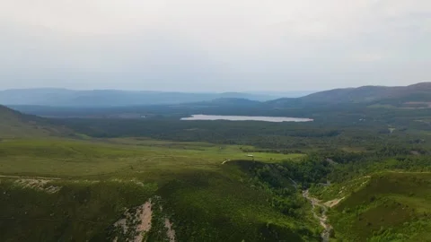 Aerial/Drone View over field and lake in Scotland. Stock Footage 263194953