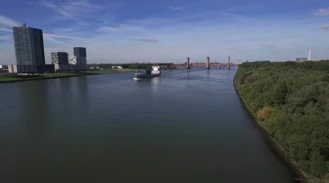 Aerials big ship approaching on river 25fps Stock Footage 57315509