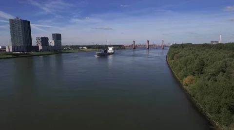 Aerials big ship approaching on river 30fps Stock Footage 57315538