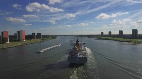 Aerials big ship at speed tracking over river 25fps Stock Footage 57315595