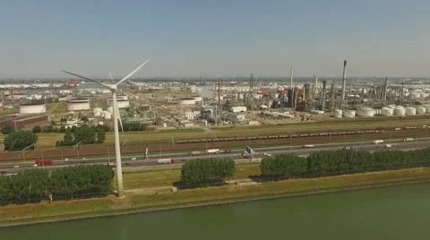 Aerials Botlek Europoort Rotterdam Industry and windmill steady shot Stock Footage