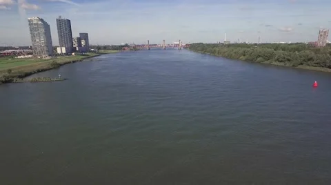 Aerials Over river towards bridge and industrial zone Stock Footage 57306958