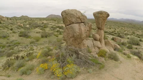 Aerials in Phoenix AZ - fly through big rocks on trail Stock Footage 58232114