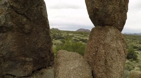Aerials in Phoenix AZ - fly through big rocks on trail Stock Footage 58232774