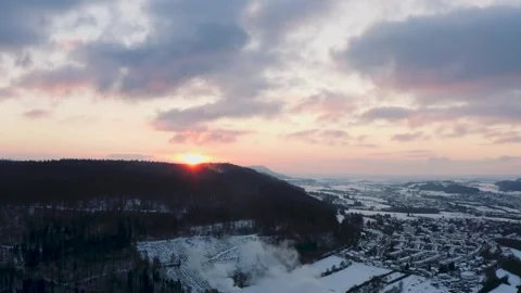 Aerials of Winter Forest Landscape at Sunset with Smoke Rising over Town 库存影片 331164106