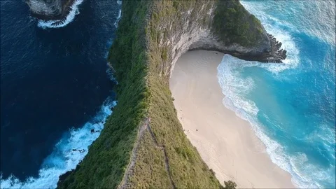 Aerial/top view of beach, sand, sea, blue ocean, waves, mountain, forest, trees Stock Footage 84050853