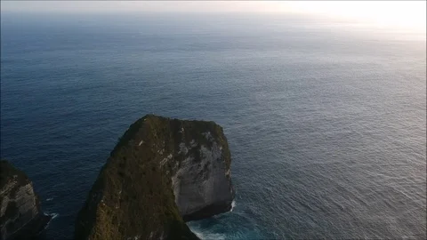 Aerial/top view of sunset, mountain, forest, jungle, ocean, clouds, sky Stock Footage 84050763