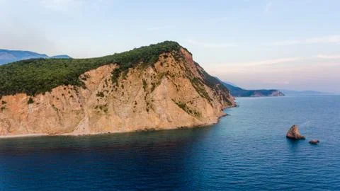 Aeriel view point of sheer cliffs raising from the sea. Stock Photos