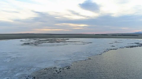 Aerila view of a springtime sunrise on small lake. Stock Footage 106966850