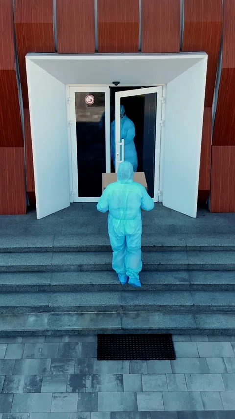 Aero. Delivery of parcel with essential goods to hospital during coronavirus Stock Footage 316775953