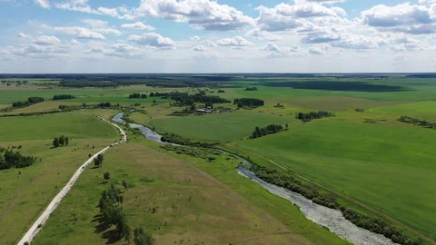 Aero flight over the river Koelga and green fields Stock Footage 128282863