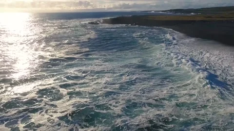 Aero frame sea, waves, coast, beach, sunset in Iceland 動画素材 131243601