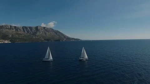 Aero shooting of two yachts in the open sea Stock Footage 81111622