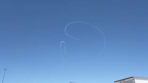 Aerobatic Plane with Smoke System Drawing in the Sky Stock Footage 83403605