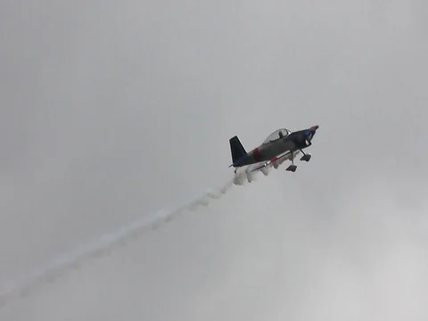 Aerobatic roll close tracking shot overhead Stock Footage 83598942