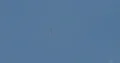 Aerobatics glider pulling white smoke lines from wings in the blue sky 4k or 4k+ Resolution