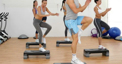 Aerobics class stepping and clapping tog... | Stock Video | Pond5
