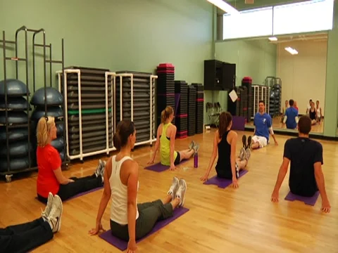 Aerobics Class Stretching on floor Stock Footage 7728159