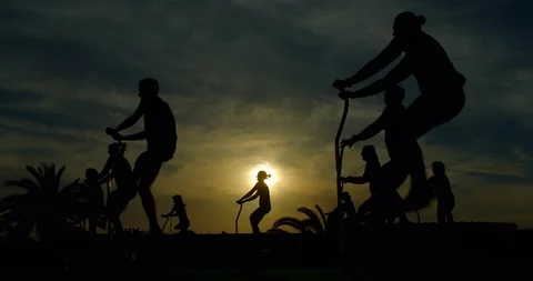 An Aerobics class using trampolines in the sun. 스톡 동영상 85538387