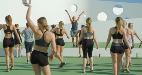 An Aerobics dance instructor takes a fun class. Vídeo Stock 85569964