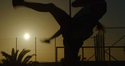 An Aerobics Instructor takes a class at Sunset. Video stock 85569666