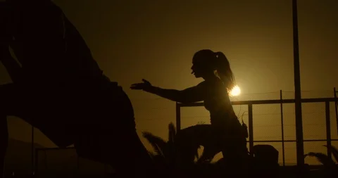 An Aerobics Intructor taking a class at sunset. 스톡 동영상 85539841