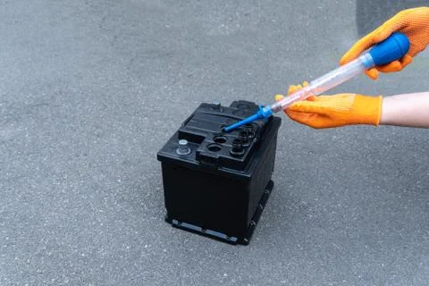 The aerometer measures the density of the electrolyte in the battery Stock Photos