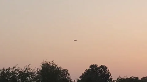 Aeroplane flying in the evening Stock Footage 247167309